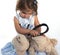 Cute little girl examining teddy