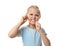 Cute little girl flossing teeth on white background