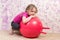 Cute little girl with gymnastic ball