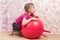 Cute little girl with gymnastic ball