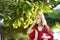 Cute little girl harvesting grapes in a vineyard