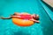 Cute little girl have fun at the pool, child relax in floatie