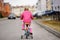 Cute little girl learning ride a bicycle