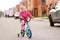 Cute little girl learning ride a bicycle