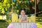 Cute little girl at lemonade stand. Summer refreshing natural drink