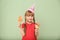 Cute little girl with lollipops on color background