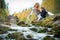 Cute little girl and mother sitting on a rock in autumn forest at stream