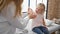 Cute little girl patient gets a band-aid on her arm by a caring doctor at the medical clinic, together they make healthcare less