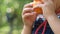 Cute little girl peeling oranges peel and eating with happiness in an orange plantation. Healthy food.