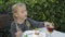 Cute little girl with pigtails eating dessert