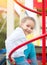 Cute little girl on the playground. Outdoor portrait of five years old girl looking at camera