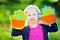 Cute little girl playing a ball catching game with sticky velcro palm pads