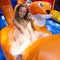 Cute little girl plays in bouncing castle