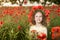 Cute little girl in the poppy field