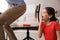 Cute little girl putting whoopee cushion on father`s chair while he sitting down at home, closeup