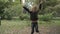 Cute little girl rejoices in the park in slowmotion