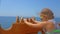 Cute little girl riding a ship on the sea. Teenager girl enjoys a boat trip on the ship.