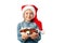 Cute little girl in santa hat with a plate of sweets isolated on white background. Happy child with lollipops and chocolate