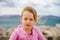 Cute little girl with ship anchor on the seaside