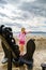 Cute little girl with ship anchor on the seaside