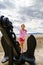 Cute little girl with ship anchor on the seaside