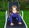 Cute little girl on sling chair