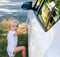 Cute Little girl standing by the car. Wanaka, New Zealand