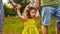 Cute little girl take hands with her father. Walking with kids concept image. Little girl holding hands with her parents. Smiling
