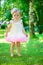 Cute little girl in tutu at park