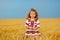 Cute little girl on wheat field