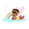 Cute little girl with wings lying on her stomach on a cloud next to the rainbow and dreaming, kids imagination and