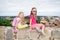 Cute little girls enjoying a view of Vilnius city from the Gediminas hill