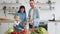 Cute little helper assisting parents in different stages of preparing food at home.