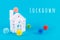 Cute little house and plastic balls aka viruses on the blue background with Lockdown wording. Epidemic, social isolation