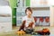 Cute little kid boy playing with lots of toy cars indoor. Happy preschooler having fun at home or nursery. Big collection of