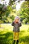 Cute little kid boy taking picture using toy photo camera