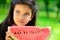 Cute little latin girl eating watermelon