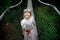 Cute little preschool girl walking on high tree-canopy trail with wooden walkway and ropeways on Hoherodskopf in Germany