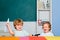 Cute little preschool kid boy study in a classroom. Educational process. Elementary school and education. Funny toddlers