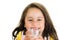 Cute little preschooler girl drinking a glass of