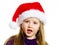 Cute little preschooler girl in red santa hat with gift box