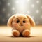 Cute little puppy on a brown background with bokeh effect. Plush beige toy, soft focus. Tiny fluffy toy sitting on beige