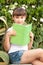 Cute Little School Girl Reading Book