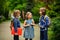 Cute little school students briskly talk on the schoolyard.