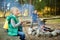 Cute little sisters and their father roasting hotdogs on sticks at bonfire. Children having fun at camp fire. Camping with kids in