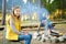 Cute little sisters and their father roasting marshmallows on sticks at bonfire. Children having fun at camp fire. Camping with