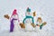 Cute little snowman group outdoor. Merry Christmas and Happy new year. Cute snowmen standing in winter Christmas