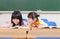 Cute little student look her classmate homework