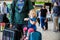 Cute little toddler girl and father at the airport. Happy family traveling by plane, making vacations. Young dad and