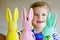 Cute little toddler girl with three colored pastel bunnies Happy baby child having fun with Easter decorations bunny in